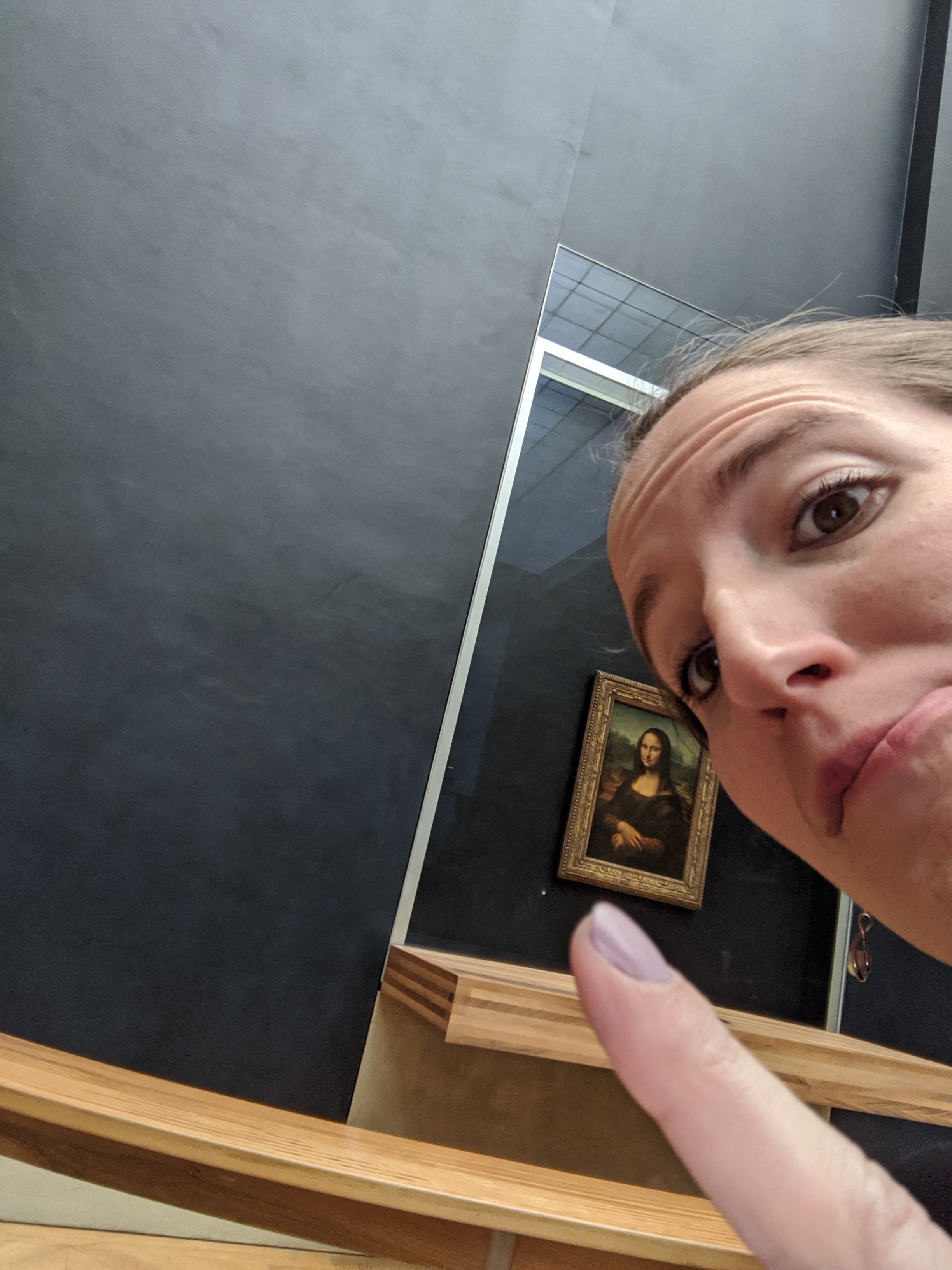 At the Louvre looking at the Mona Lisa on a two day journey to Paris. 