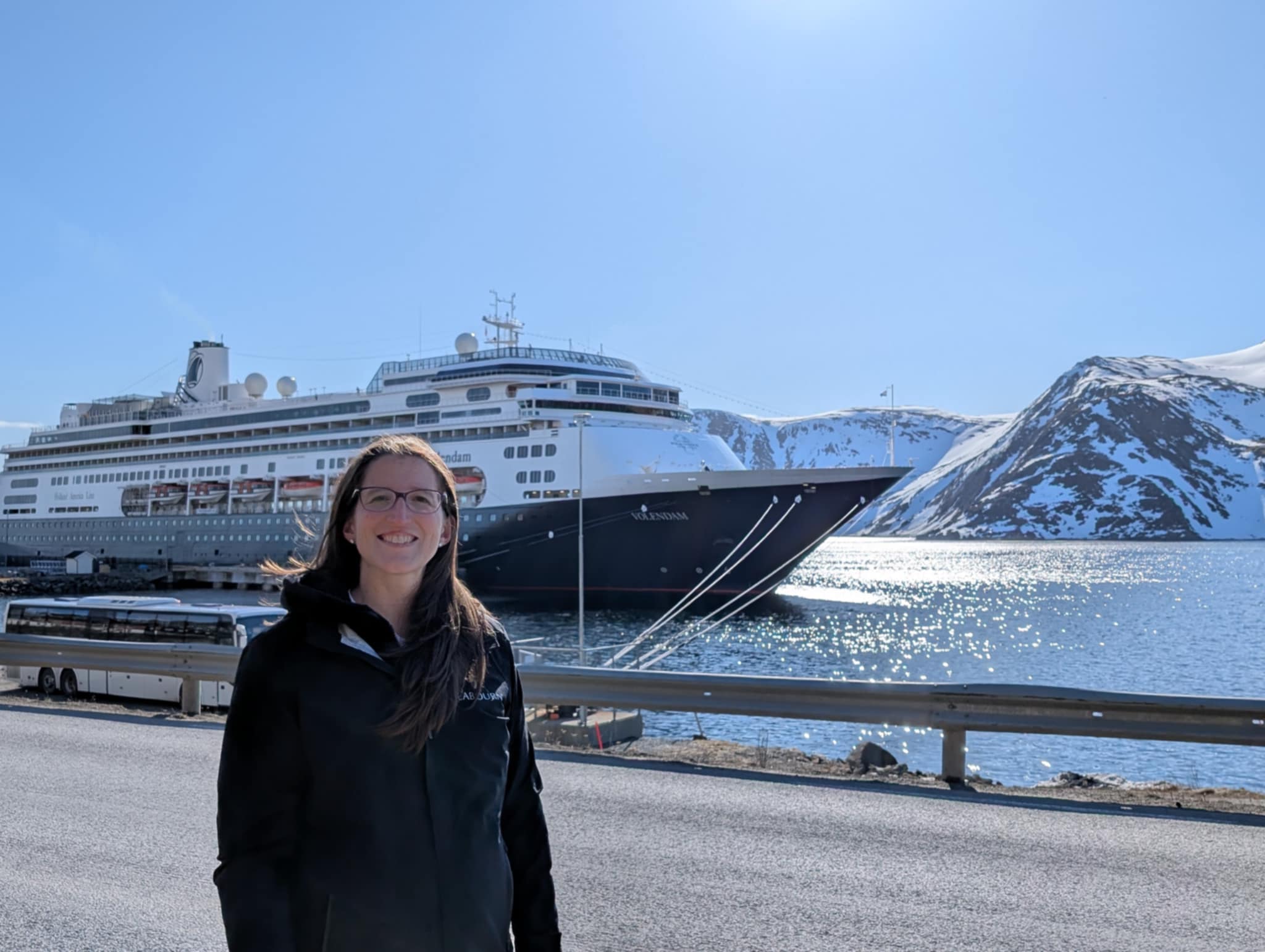 Woman in front of Holland America Line's cruise ship in Norway